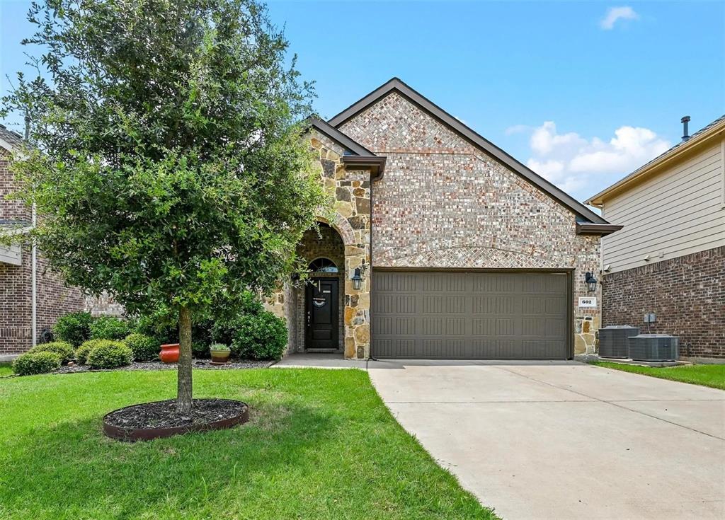 Brick and stone exterior with an arched entry Brick and stone exterior with an arched entry