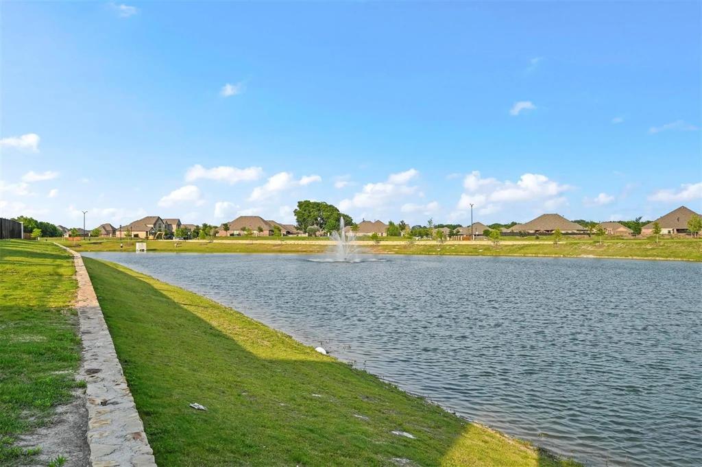 Expansive body of water featuring a central fountain