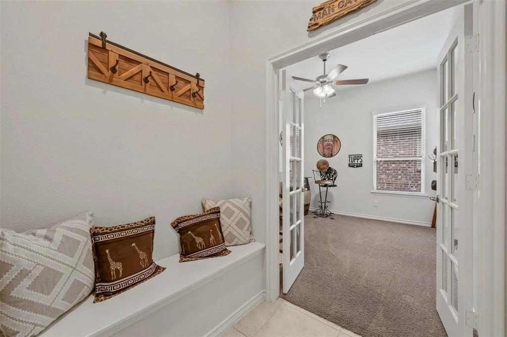 Built-in entryway bench with a wood-finish coat rack