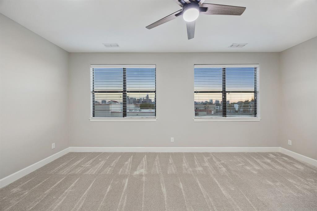 Primary bedroom with unobstructed skyline view.
