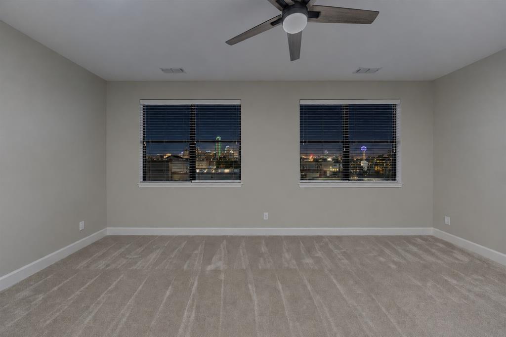 Primary bedroom with skyline view
