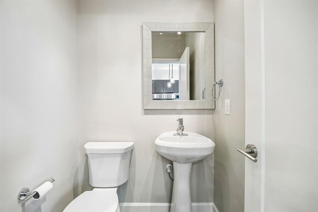 Half bathroom off kitchen and living room