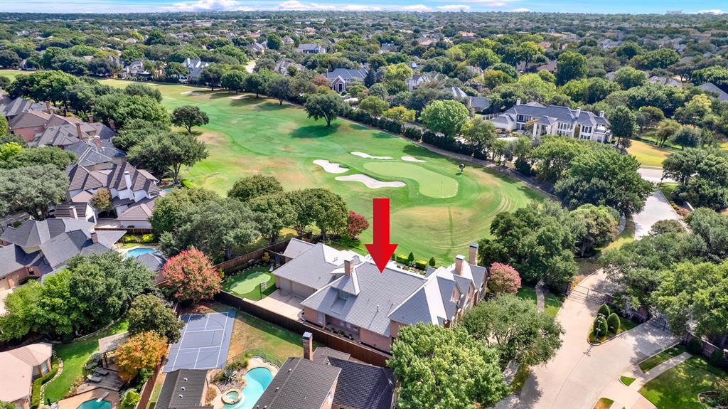 This wide panorama captures the estate’s prime location, showing the entire community of custom homes nestled along the manicured fairways and bunkers of the championship Gleneagles Queens course. Imagine waking up to these endless green vistas and enjoying easy access to the clubhouse right from your neighborhood streets.