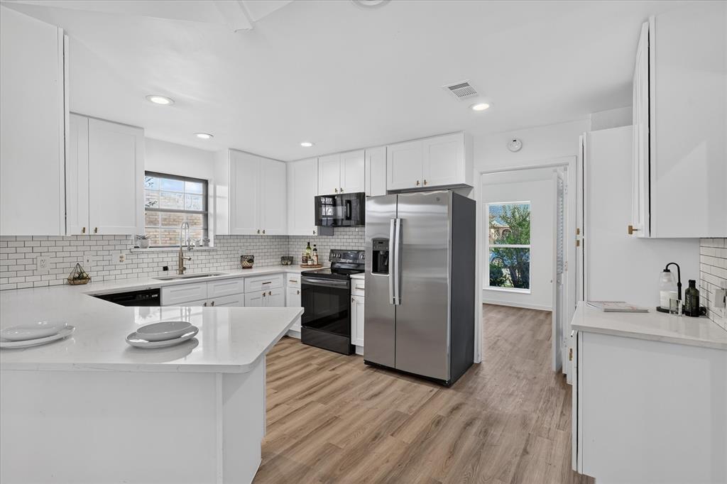 Another view of kitchen. Fridge will remain if buyer would like it.