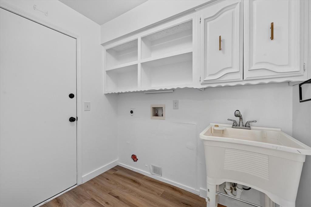 Half bath is to the right of this washer room. You also have access to the garage for guest that are using the pool.