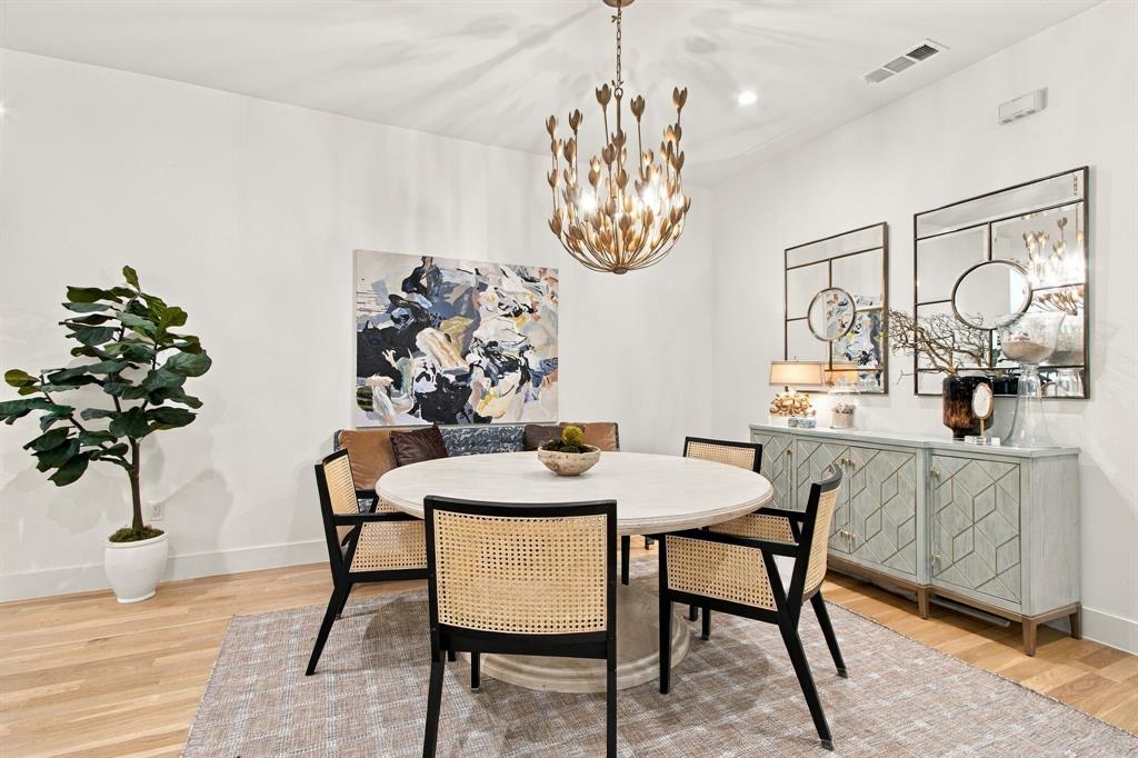 Hardwood-finish flooring, recessed lighting, and a decorative ceiling fixture