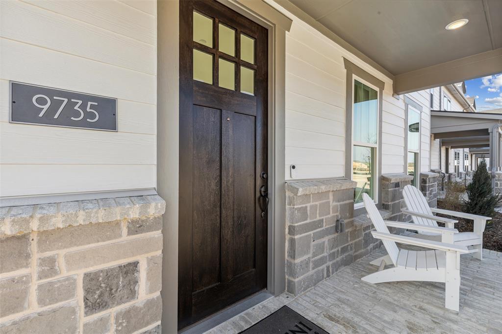 The stone and brick facade with Craftsman front door welcomes friends and family into your new dream home! The stone and brick facade with Craftsman front door welcomes friends and family into your new dream home!