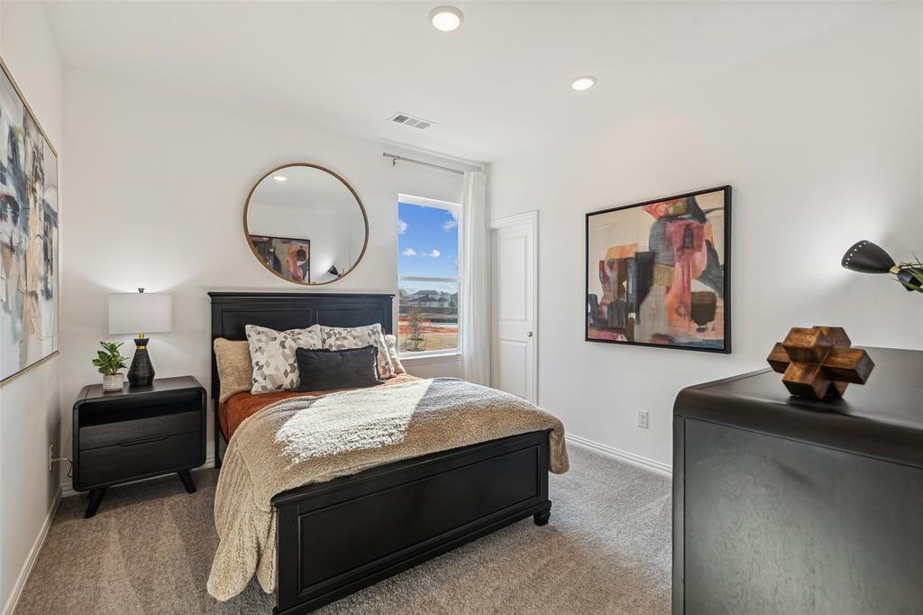 You'll find nicely sized secondary bedrooms in our Tatum plan.