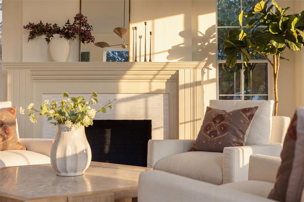 Stunning living room fireplace with tailored mantel and dimensional tile surround.