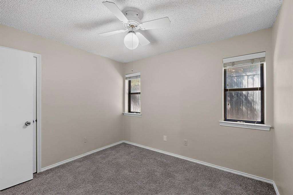 Neutral-toned walls complement plush carpeting