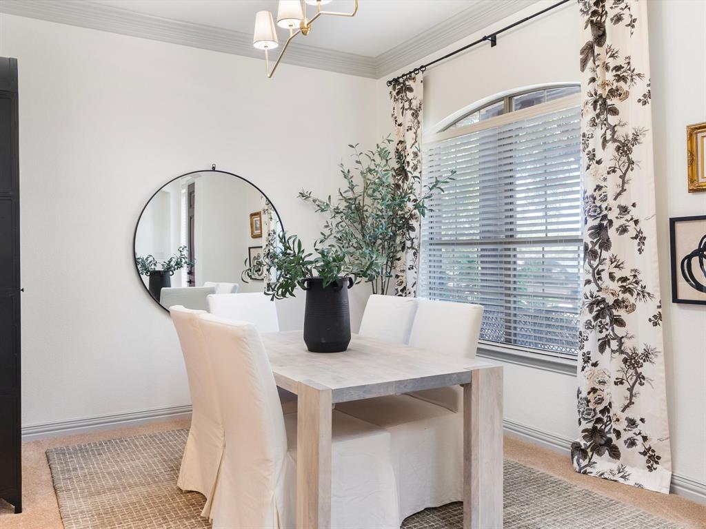 Formal dining room with additional entry through the butler's pantry and kitchen