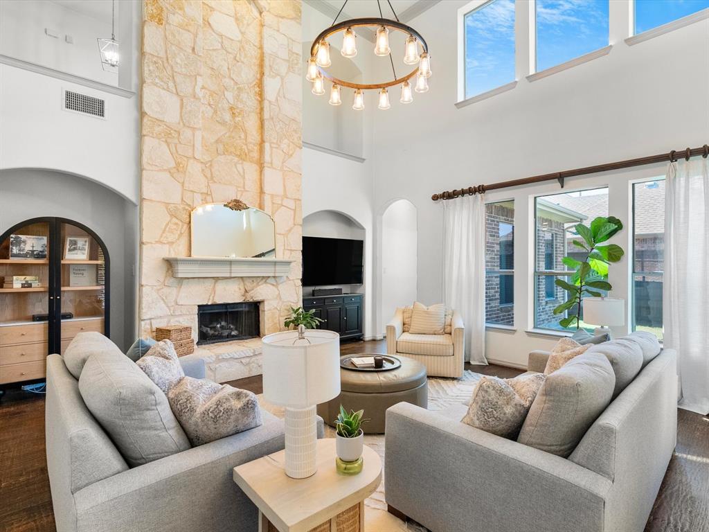 Impressive floor-to-ceiling stone fireplace complete with hearth and gas logs