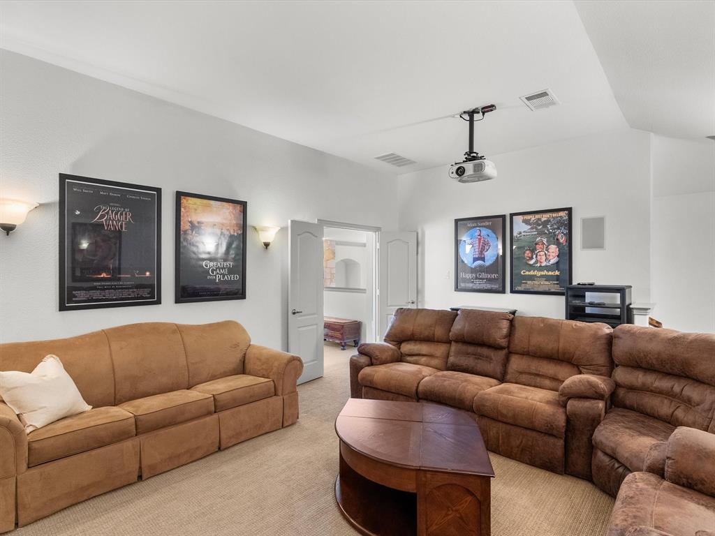 Media room has two entries, one off of the game room and the other by means of a secondary staircase
