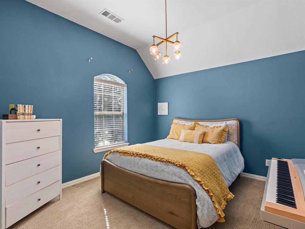 Secondary upstairs bedroom with upgraded lighting