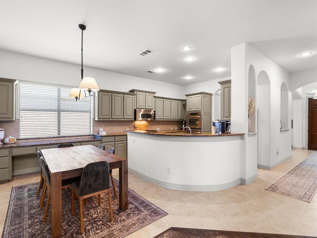 Eat-in kitchen complete with plenty of storage and built-in desk area