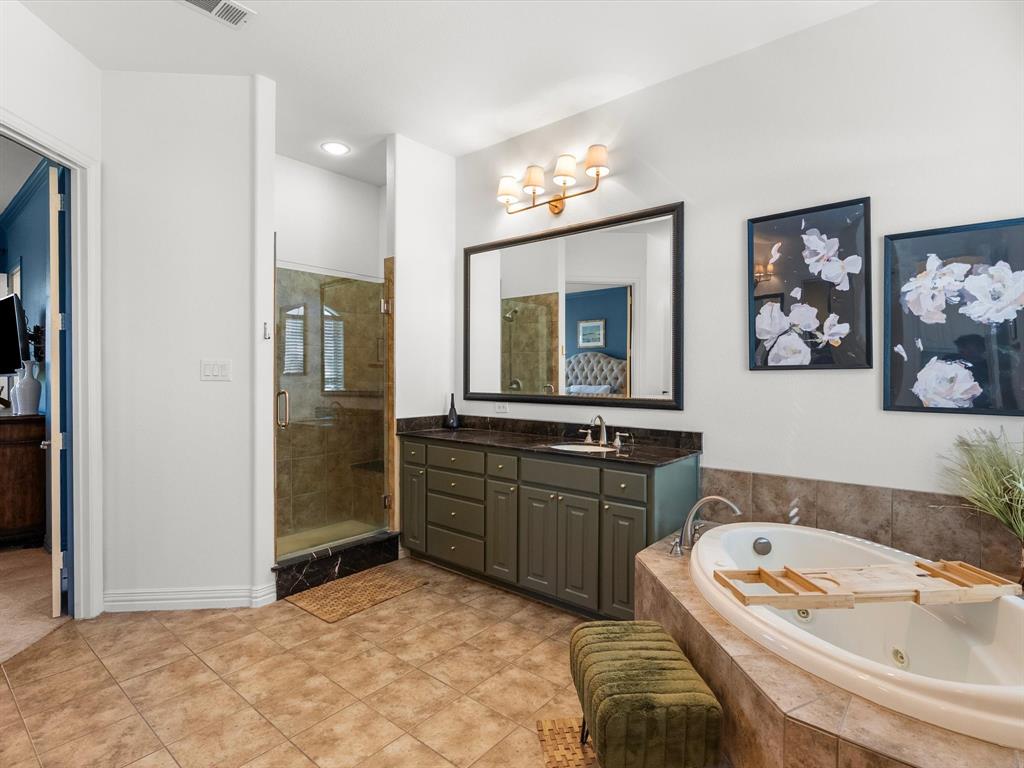 Large, jetted soaking tub and walk-in shower