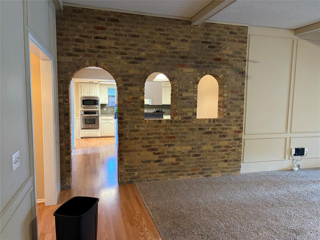 Brick archways featuring a built-in kitchen pass-through