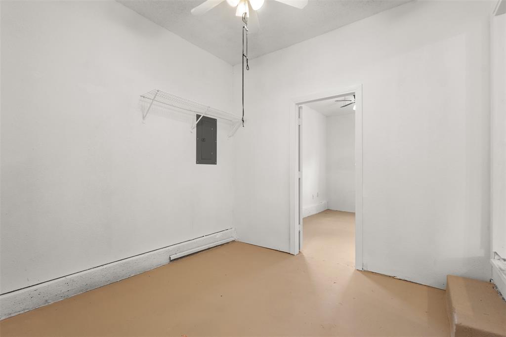 White painted walls with tan flooring