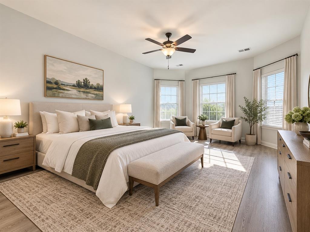 Recessed lighting, wood-finish flooring, ceiling fan, and multiple windows with blinds Recessed lighting, wood-finish flooring, ceiling fan, and multiple windows with blinds