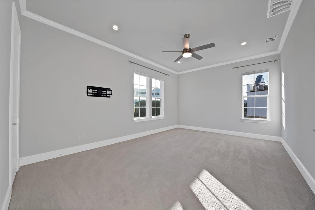 Recessed lighting, ceiling fan, crown molding, double windows, and carpet flooring