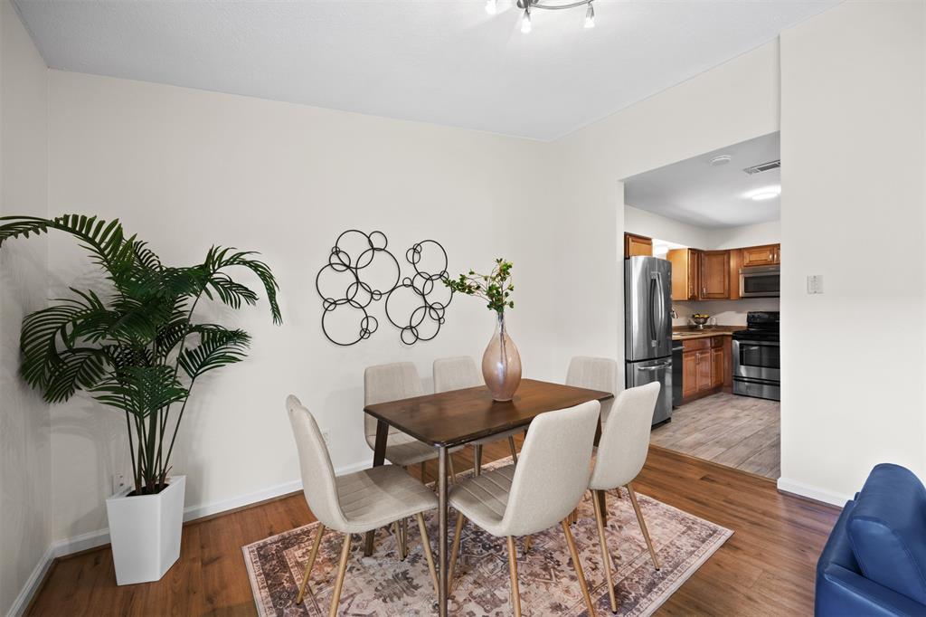 Hardwood-style flooring in dining area