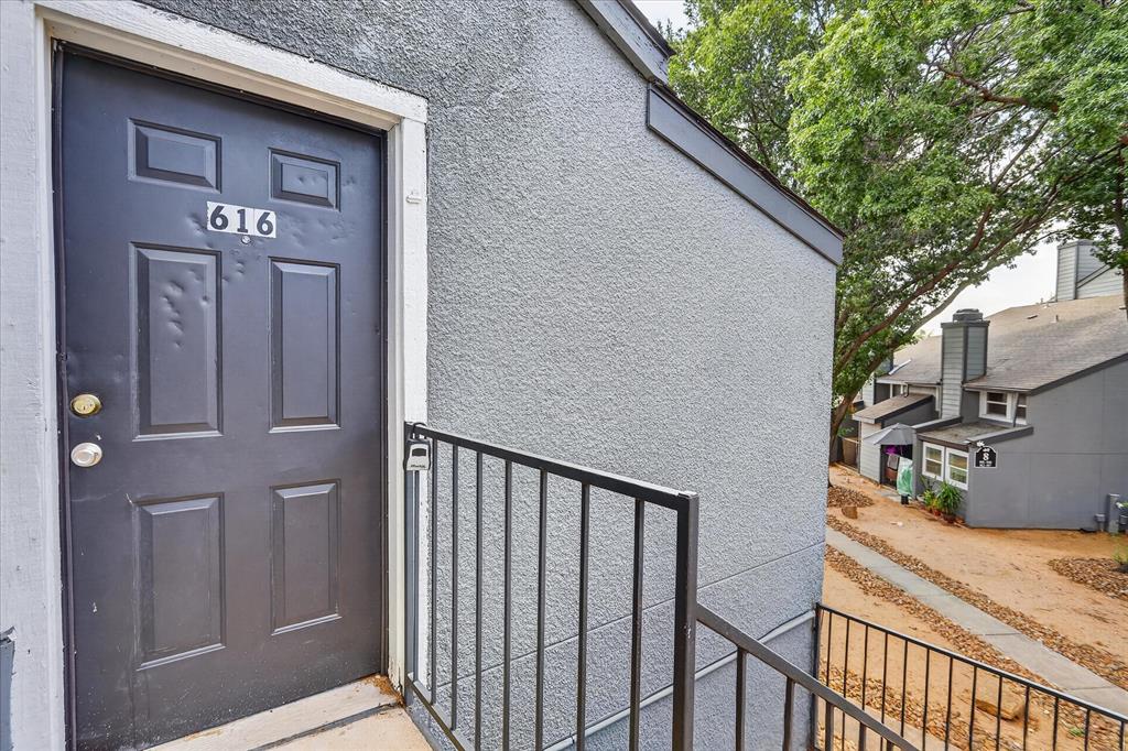 Textured exterior finish with a contrasting dark entrance door
