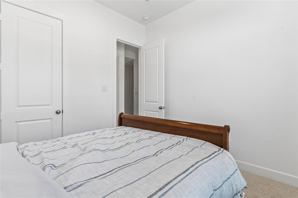 Carpeted flooring, white walls, and white trim