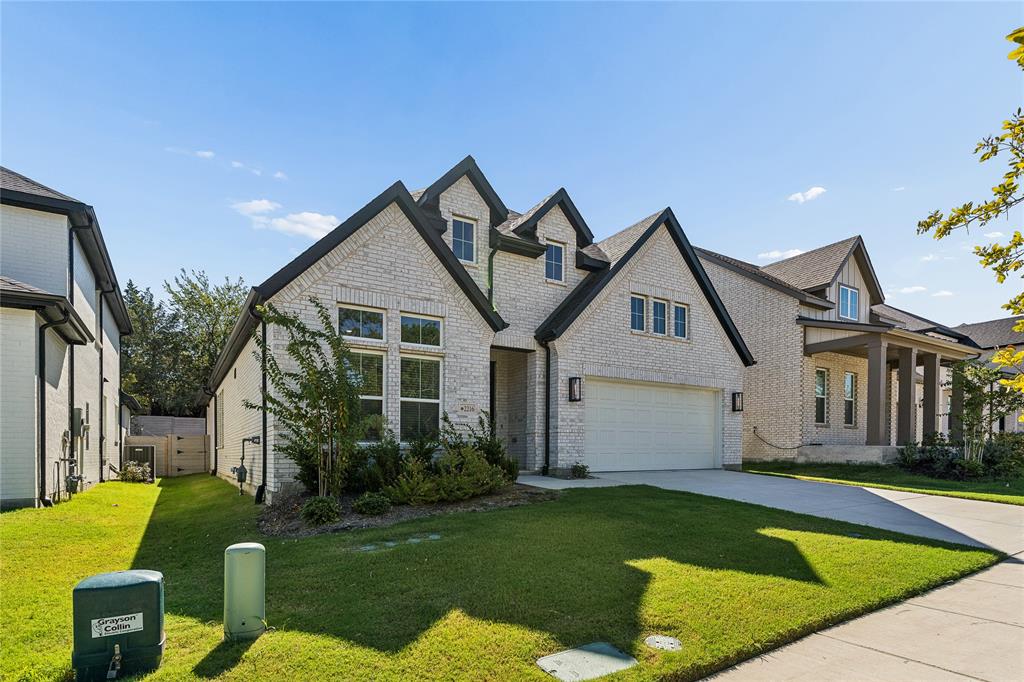 Brick facade with black trim accents and multiple gables