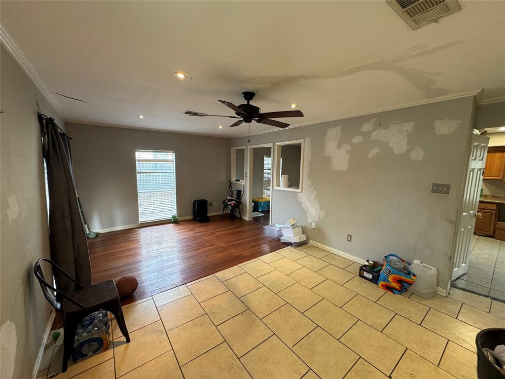 Recessed lighting, ceiling fan, crown molding, wood-finish flooring, and tile flooring