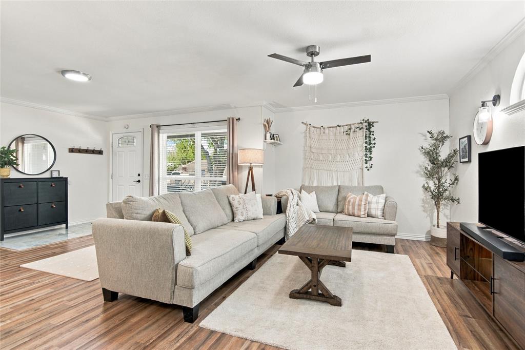 Wood-finish flooring throughout, complemented by a ceiling fan with integrated lighting Wood-finish flooring throughout, complemented by a ceiling fan with integrated lighting
