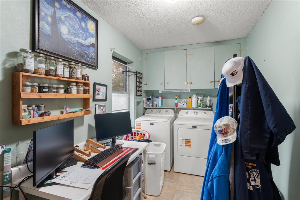 Built-in upper cabinetry, dedicated shelving, and a single window