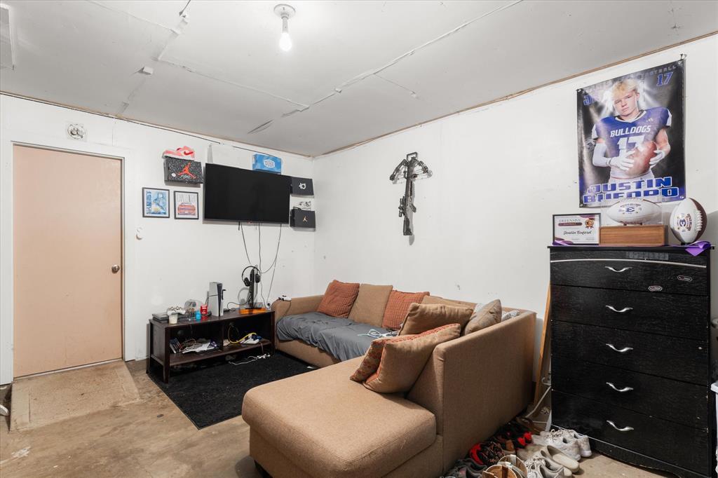 Interior room featuring smooth-finish wall surfaces, neutral-tone painted walls, and a single-panel interior door