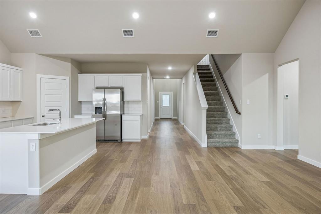 Open First Floor in the Wimbledon home plan by Trophy Signature Homes – REPRESENTATIVE PHOTO
