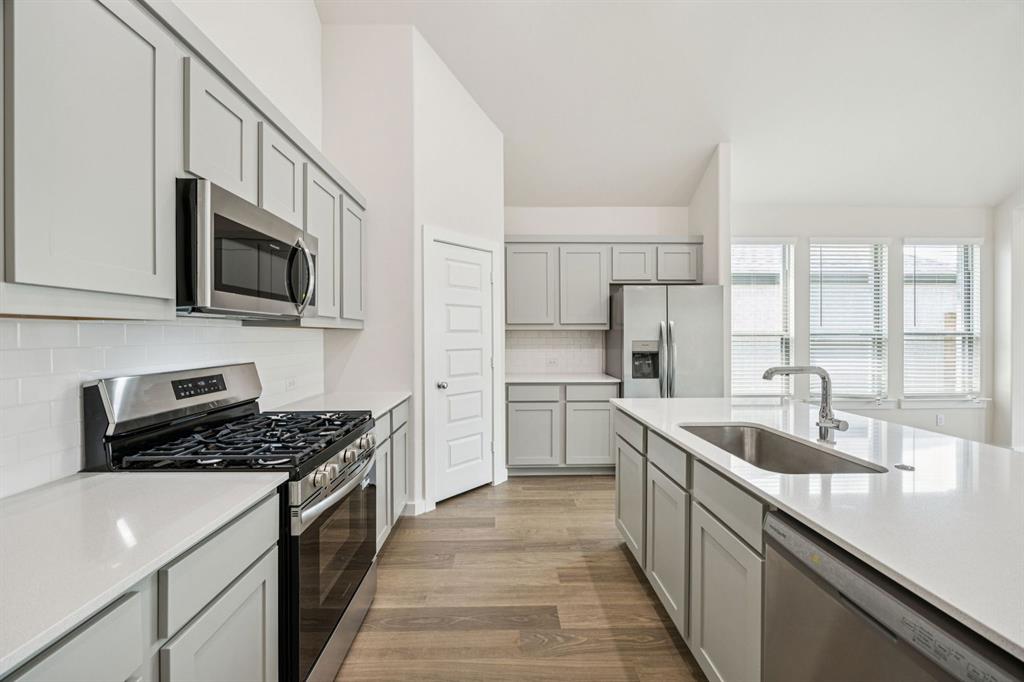 Kitchen in the Claret home plan by Trophy Signature Homes – REPRESENTATIVE PHOTO Kitchen in the Claret home plan by Trophy Signature Homes – REPRESENTATIVE PHOTO