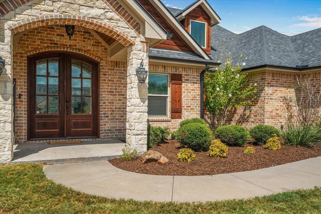 Brick and stone exterior with a gabled roofline Brick and stone exterior with a gabled roofline