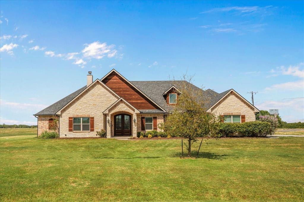 Brick and wood-sided exterior with a gabled roofline