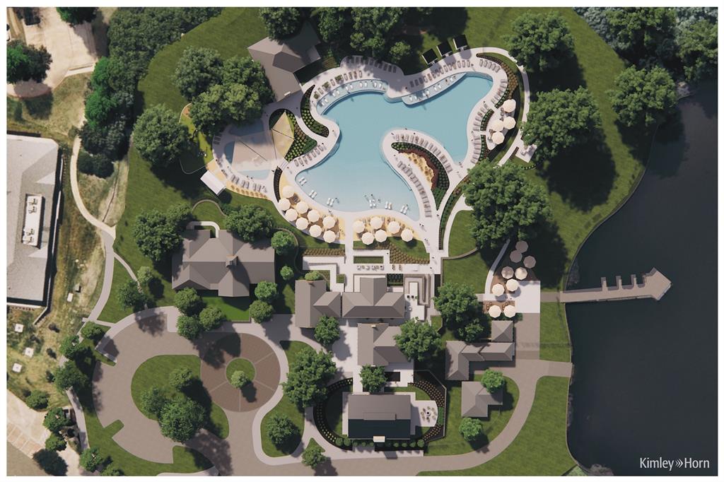 Expansive property with a large, freeform swimming pool, multiple leisure areas with umbrellas, a private dock extending into the water, a well-defined circular drive, and lush green landscaping