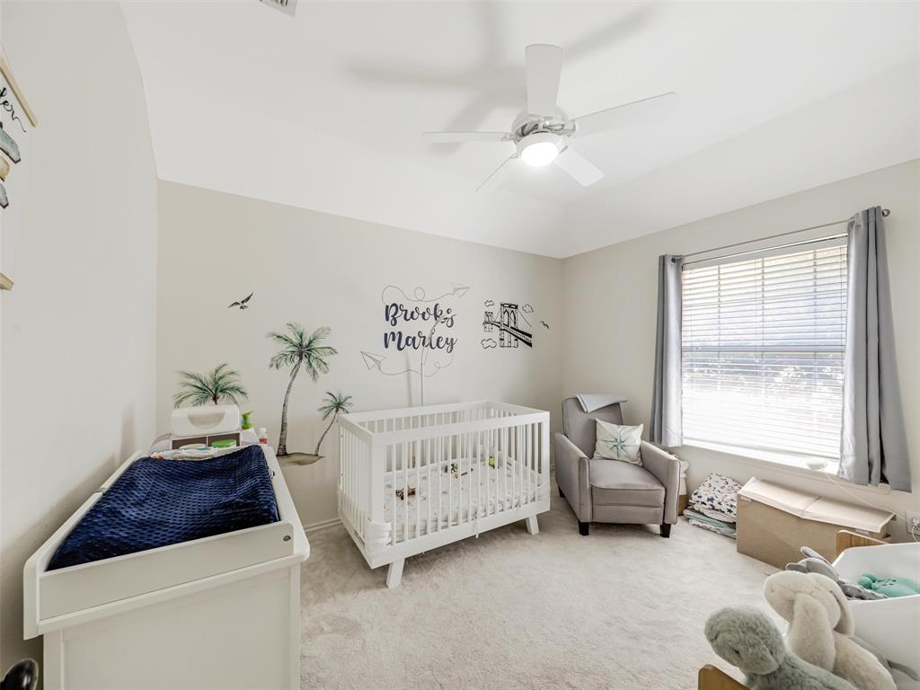 Recessed lighting, ceiling fan with light fixture, large window with blinds, light gray wall paint, and light-colored carpeting throughout