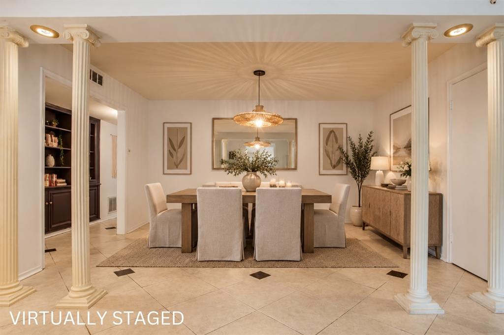 Recessed lighting, decorative columns, tiled flooring with accent squares, built-in shelving, and a modern light fixture