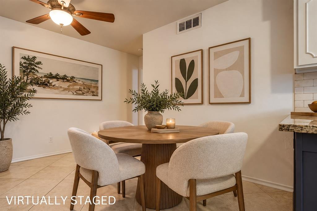 Tile flooring, ceiling fan with integrated lighting, built-in cabinetry, subway tile backsplash, and granite countertop