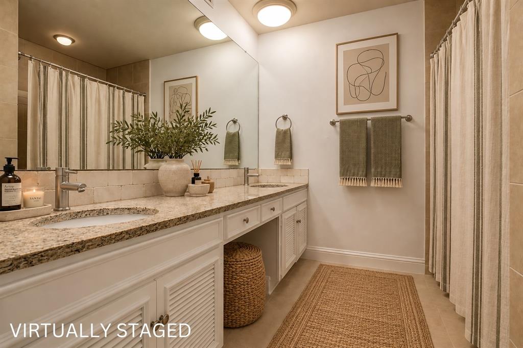 Dual vanity with stone-finish countertop, undermount sinks, and chrome fixtures