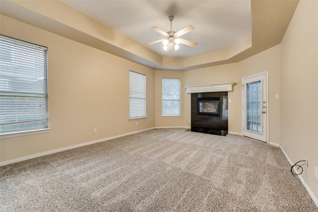 Master Bedroom with Cozy Fireplace leading to the deck where you can sit and enjoy morning coffee
