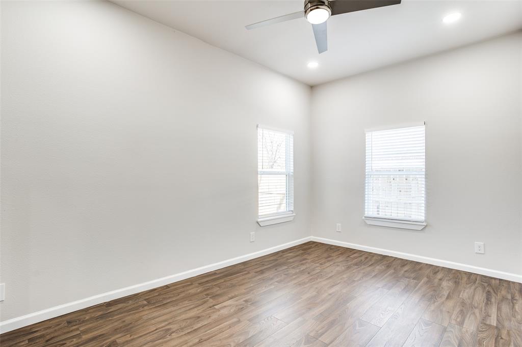 Empty room featuring baseboards, recessed lighting, a ceiling fan, and dark wood finished floors