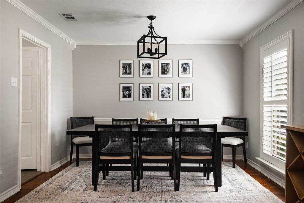 Hardwood flooring, crown molding, chair rail molding, and plantation shutters