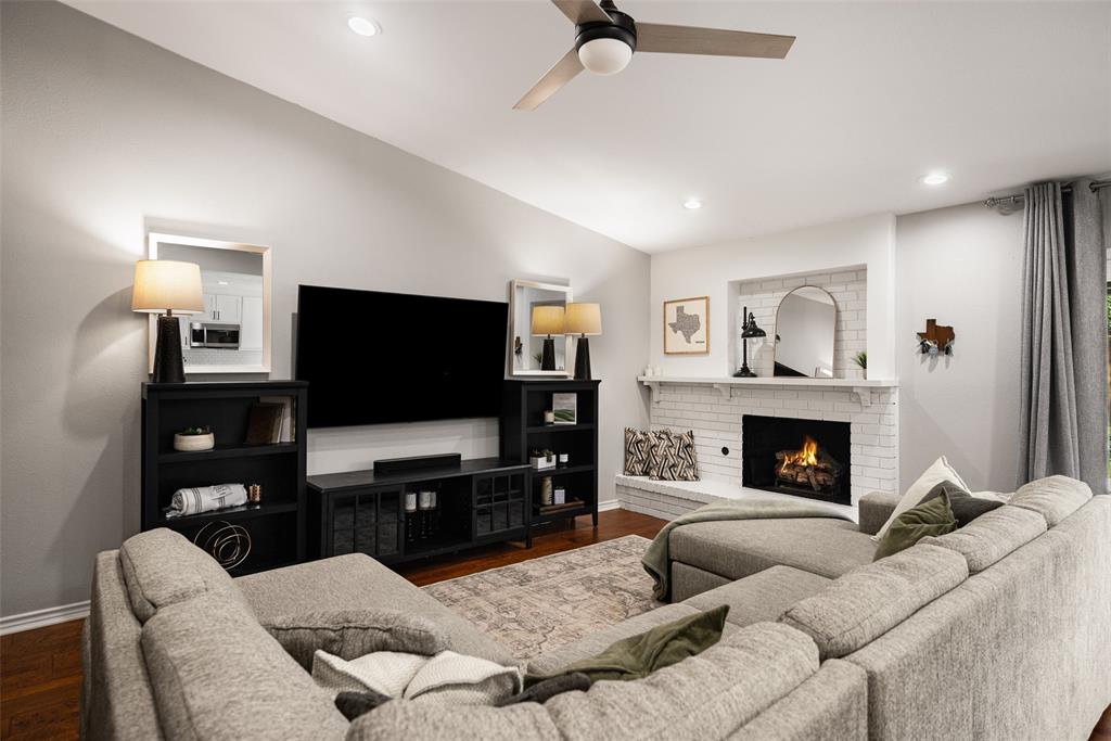 Vaulted ceiling with recessed lighting and a ceiling fan