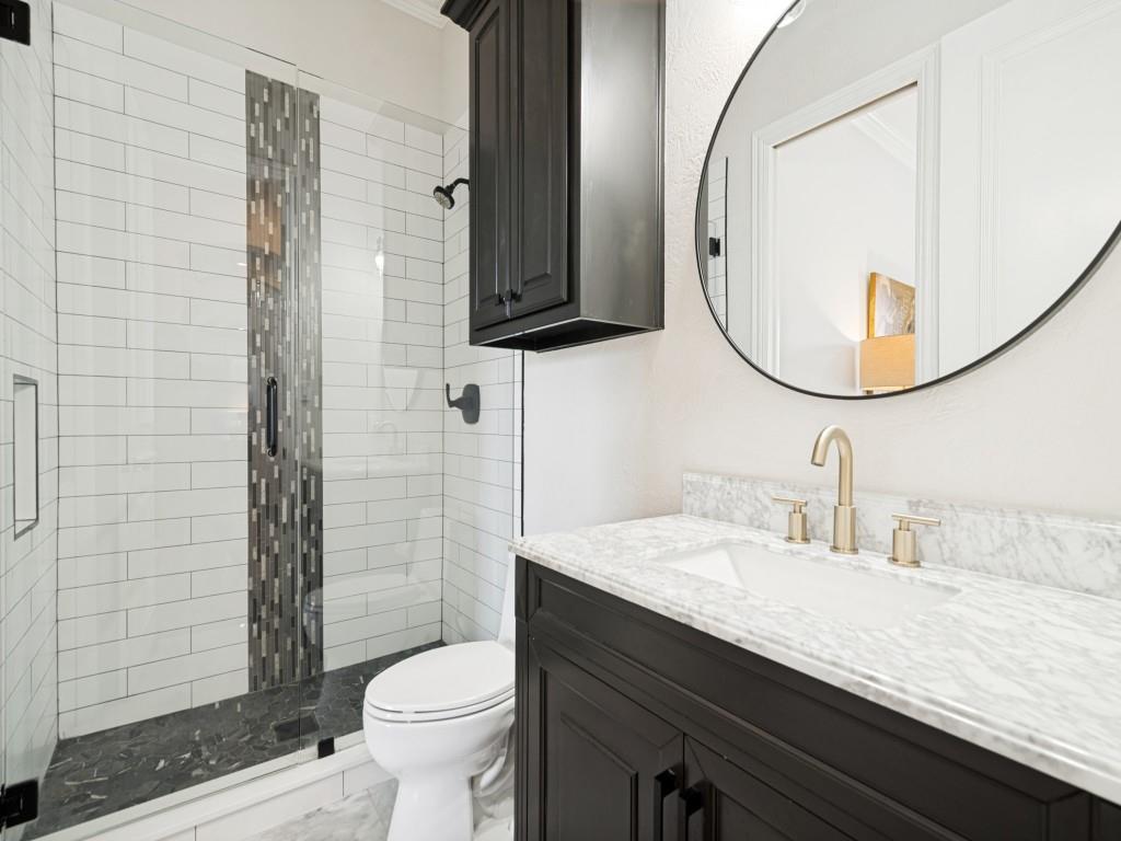 Ensuite bath to the downstairs bedroom is also accessible through a hall entry.