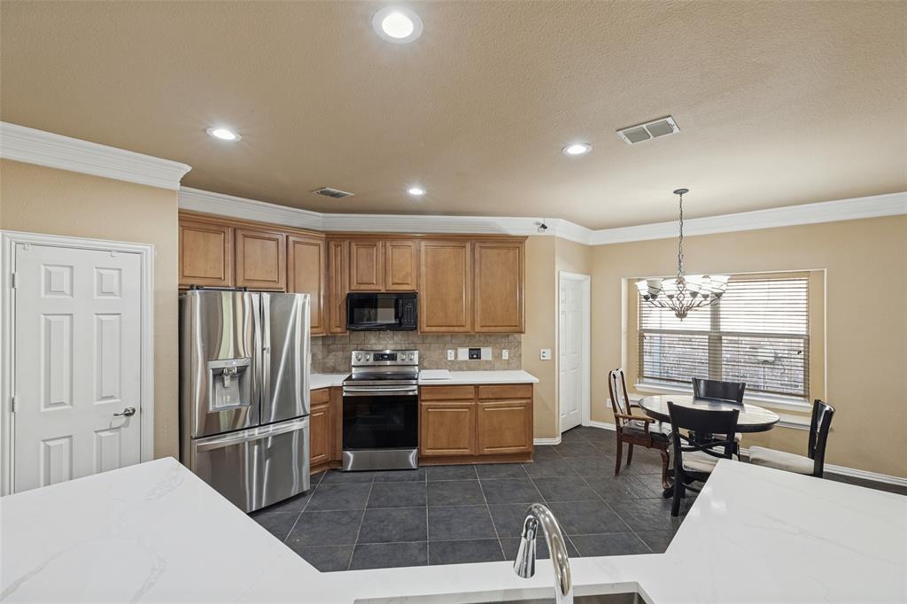 Kitchen featuring recessed lighting, and crown molding