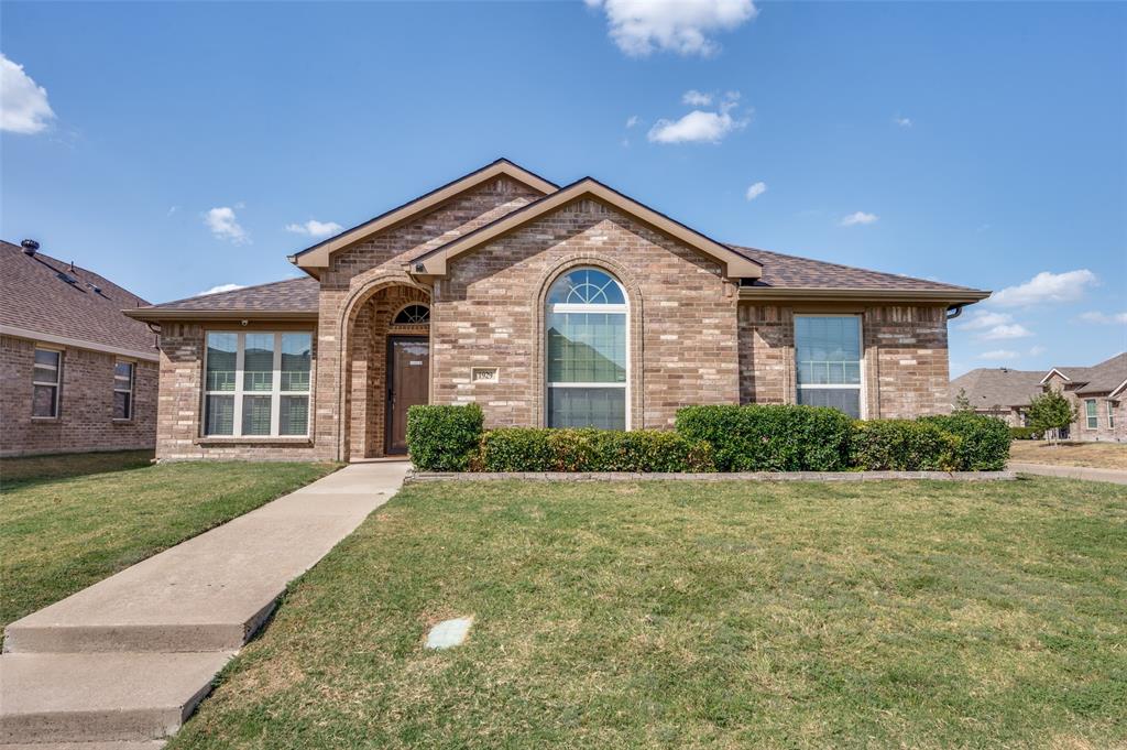 Brick exterior with an arched entry and an arched window Brick exterior with an arched entry and an arched window