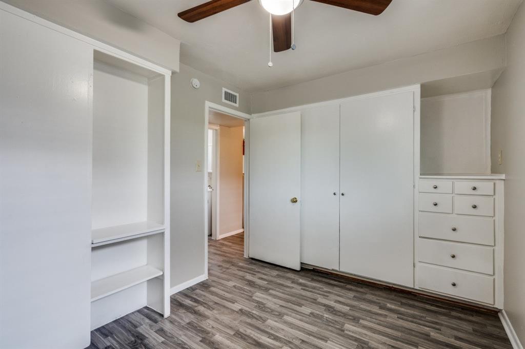 Built-in storage solutions, wood-finish flooring, and a ceiling fan