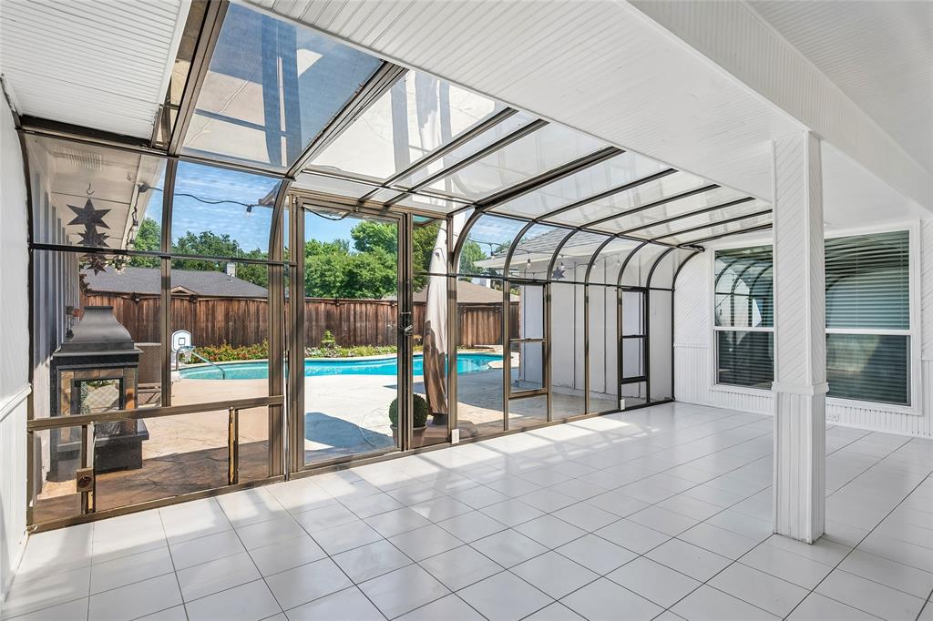 Enjoy entertaining in the bright sunroom opening to the backyard